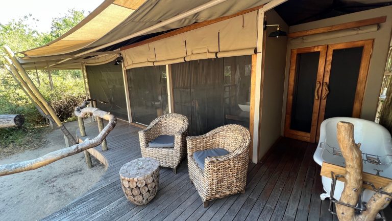 Botswana safari: outdoor clawfoot bathtub on tent deck