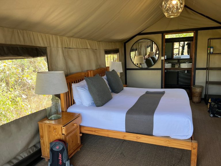 Botswana safari: safari tent interior with double bed and ensuite